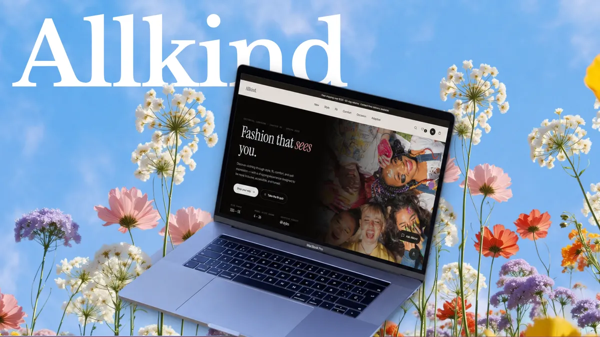 A laptop showing the Allkind homepage, “Fashion that sees you”, set among wildflowers under a blue sky with the Allkind wordmark.