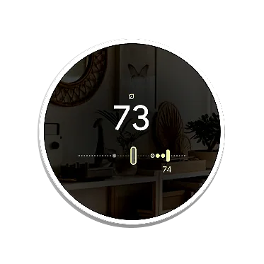 The round thermostat display in a living room at 73 degrees, with green dots marking the active eco range on the slider.